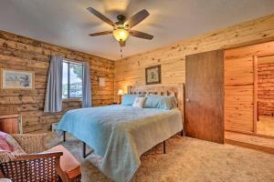 a bedroom with a bed and a ceiling fan at Sprawling Mountain-View Cabin 5 Mi to Mesa Verde in Mancos