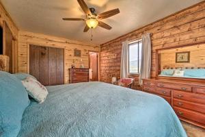 a bedroom with a bed and a ceiling fan at Sprawling Mountain-View Cabin 5 Mi to Mesa Verde in Mancos
