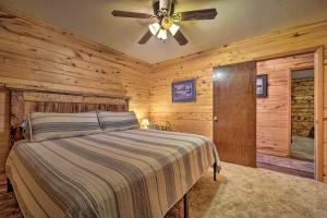 a bedroom with a bed and a ceiling fan at Sprawling Mountain-View Cabin 5 Mi to Mesa Verde in Mancos