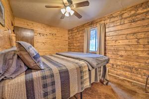 a bedroom with a bed and a ceiling fan at Sprawling Mountain-View Cabin 5 Mi to Mesa Verde in Mancos