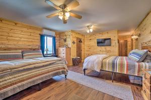 a bedroom with two beds and a ceiling fan at Sprawling Mountain-View Cabin 5 Mi to Mesa Verde in Mancos