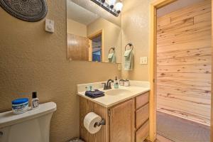 a bathroom with a sink and a toilet and a mirror at Sprawling Mountain-View Cabin 5 Mi to Mesa Verde in Mancos