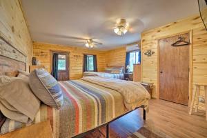 a bedroom with a bed in a log cabin at Sprawling Mountain-View Cabin 5 Mi to Mesa Verde in Mancos