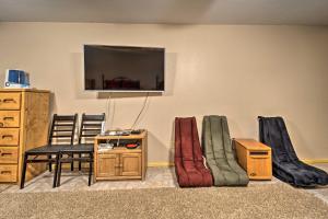 a living room with a tv and some pillows at Sprawling Mountain-View Cabin 5 Mi to Mesa Verde in Mancos
