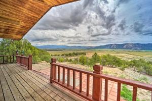 a wooden deck with a view of the mountains at Sprawling Mountain-View Cabin 5 Mi to Mesa Verde in Mancos