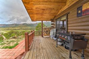 a deck with a grill on a house at Sprawling Mountain-View Cabin 5 Mi to Mesa Verde in Mancos