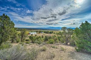 an aerial view of a field with trees and a trailer at Sprawling Mountain-View Cabin 5 Mi to Mesa Verde in Mancos
