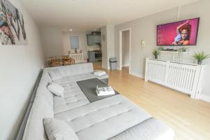 a living room with a couch and a table at Diamond Apartment in Belfast
