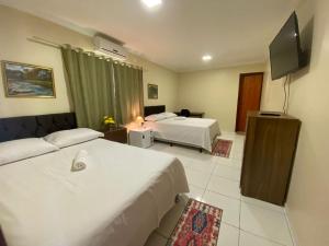Postel nebo postele na pokoji v ubytování Bertolini Hotel