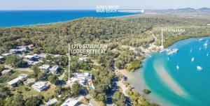 an aerial view of a resort on the shore of a beach at 1770 Sovereign Lodge Retreat in Seventeen Seventy