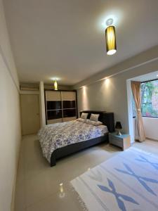 a bedroom with a large bed and a window at KLCC Studio One Bedroom in Kuala Lumpur