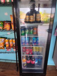 a refrigerator filled with lots of drinks at Nadi Fancy Hotel in Nadi