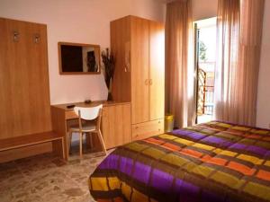 A bed or beds in a room at B&B Raggio Di Sole