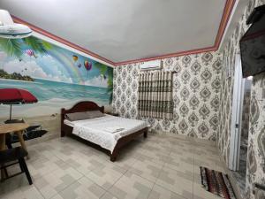 Billede fra billedgalleriet på Nhà Nghỉ Hồng Trang - Thủ Dầu Một i Xóm Mới (1) + 24 billeder