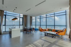 a living room with a couch and a table at Seascape Palace Hotel in Sihanoukville