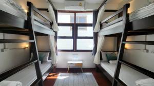 Postel nebo postele na pokoji v ubytování Mystay Hostel Nan