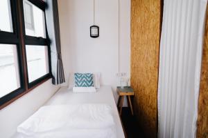 Postel nebo postele na pokoji v ubytování Mystay Hostel Nan