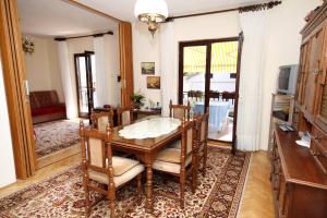 a dining room with a table and chairs at Apartments by the sea Brgulje, Molat - 6241 in Brgulje