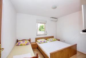 Posteľ alebo postele v izbe v ubytovaní Apartments and rooms with parking space Biograd na Moru, Biograd - 6219