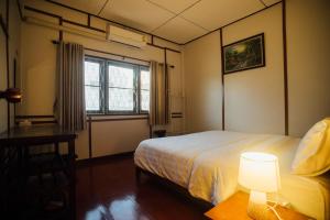 Ένα ή περισσότερα κρεβάτια σε δωμάτιο στο Nu Phen Homestay +20 φωτογραφίες