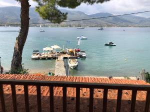 a view of a harbor with boats in the water at Sea-side 3 BEDROOM- BEACH HOUSE in Poros