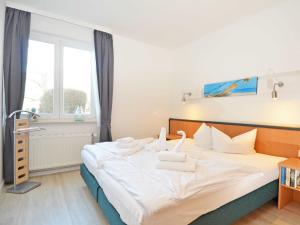 Ein Bett oder Betten in einem Zimmer der Unterkunft Wohnpark Stadt Hamburg - Apt. 01