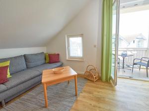 a living room with a couch and a table at Wohnpark Stadt Hamburg - Apt. 05 in Binz