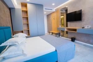 Телевизор и/или развлекательный центр в Hotel Prestige