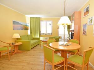 a living room with a table and chairs at Wohnpark Stadt Hamburg - Apt. 15 in Binz