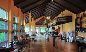 a large room with a bar in a wine store at GRANMONTE Wine Cottage in Phayayen