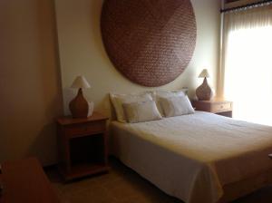 מיטה או מיטות בחדר ב-Pipa Hills Casa Bromélia