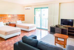 Postel nebo postele na pokoji v ubytování Garden Villa Hotel + 17 fotografií