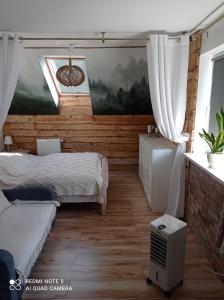 Posteľ alebo postele v izbe v ubytovaní Apartament Cisowa