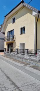 a building with balconies on the side of a street at APARTMA ŽELE in Postojna