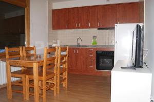 Kuchyň nebo kuchyňský kout v ubytování Apartamentos Borruscall