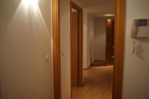 a room with a door leading to a hallway at Apartamentos Borruscall in Pas de la Casa