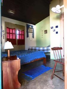 Säng eller sängar i ett rum på Pousada Hostal das Estrelas