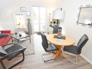 a living room with a table and chairs at Wohnpark Stadt Hamburg - Apt. 45 in Binz