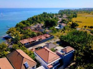 an aerial view of a resort near the water at Villa Royal Lovina in Singaraja