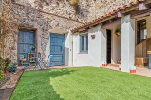 Vonkajšia záhrada v ubytovaní El Molino de Besalú Casa con jardín
