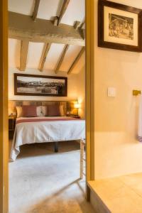 Posteľ alebo postele v izbe v ubytovaní El Molino de Besalú Casa con jardín