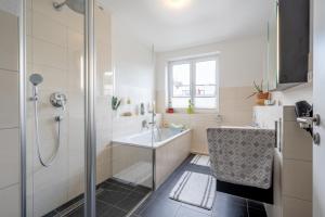 a bathroom with a shower and a sink at Private Rooms in Hannover