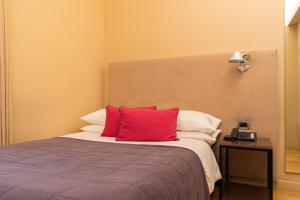 Postel nebo postele na pokoji v ubytování Herodion Hotel