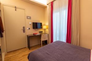 Postel nebo postele na pokoji v ubytování Herodion Hotel
