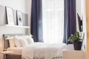 Posteľ alebo postele v izbe v ubytovaní Venus Apartments - Opera I