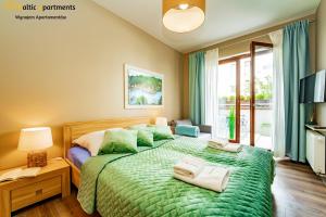 Łóżko lub łóżka w pokoju w obiekcie Baltic Apartments - Portofino