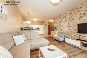 Telewizja i/lub zestaw kina domowego w obiekcie Baltic Apartments - Portofino