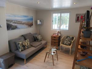 a living room with a couch and a chair at Eco Resort Costa Blanca in Dolores