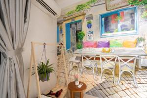 a dining room with a white table and chairs at 5 to 10 bedrooms houses in Ha Long