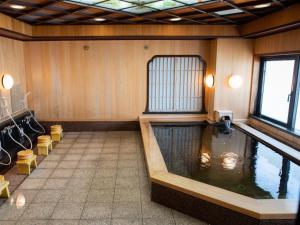 a large room with a pool of water in it at Hotel Castle Inn Ise in Ise